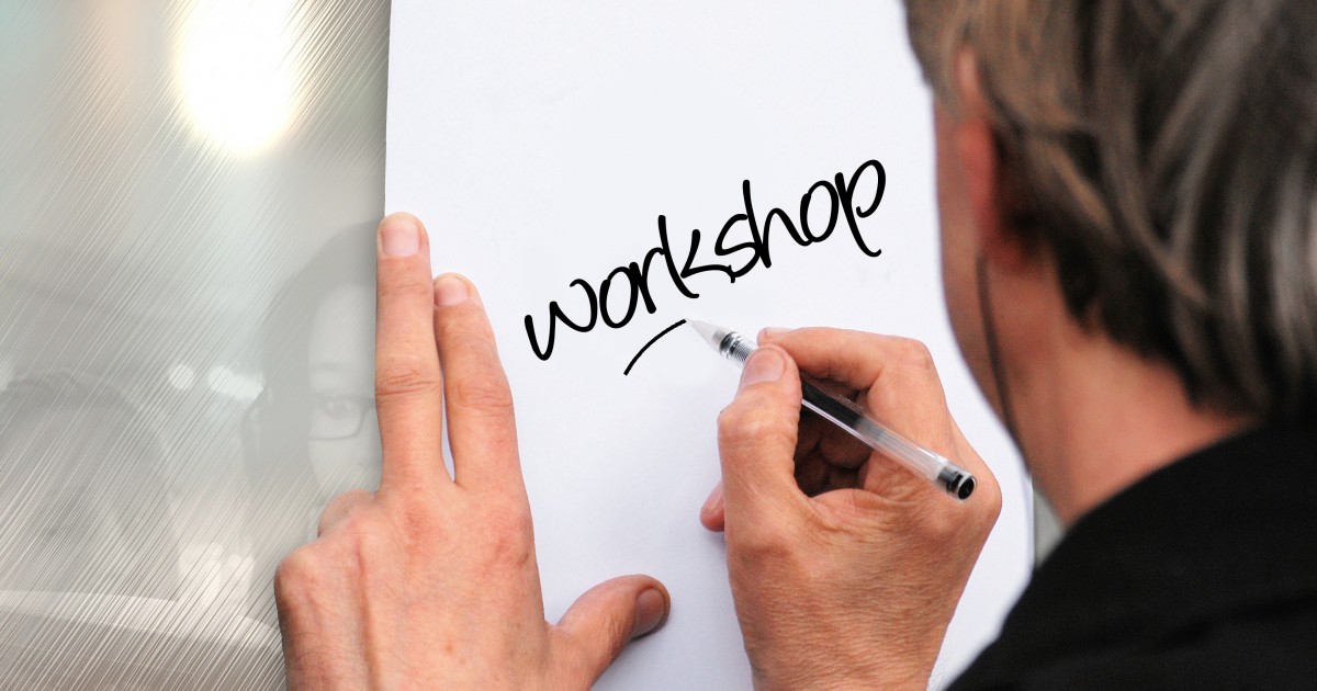Parent Booster USA Announces Free School Booster Group Workshops Man writing workshop on a piece of paper in black marker