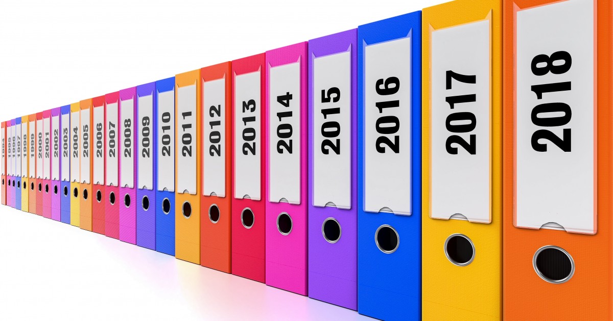 Filing Form 990 Row of colorful binders with filings from previous years