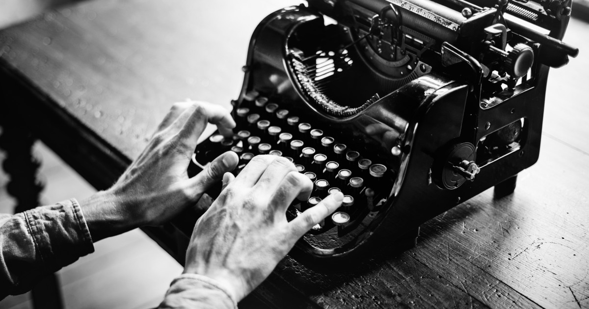 Parent Booster USA Revises IFA Policy An old fashioned typewriter with hands typing