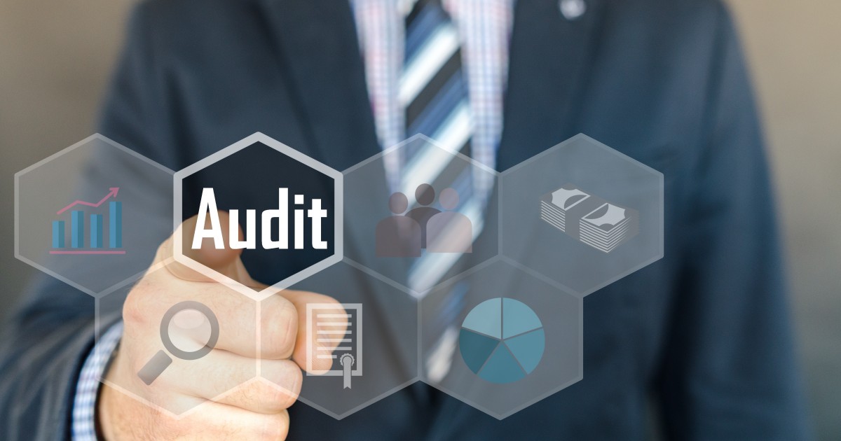 Schools Should Audit Their Booster Clubs Man pointing toward the word audit in a virtual interface