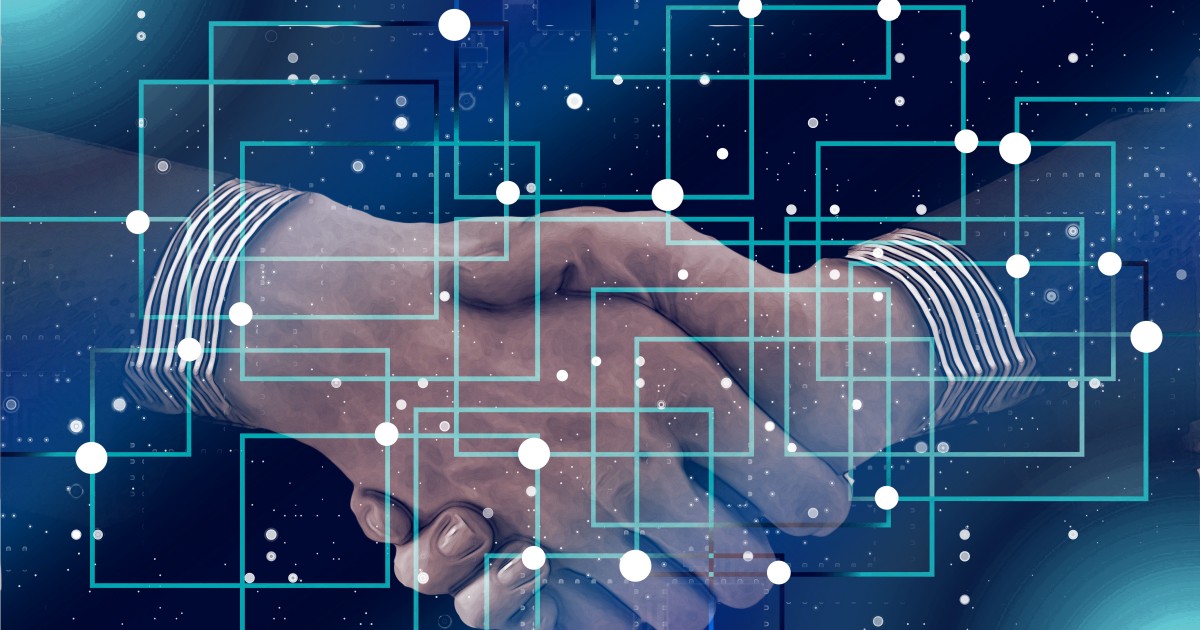 Smooth Transitions Two men shaking hands behind a futuristic overlay
