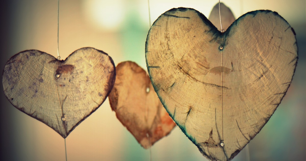 Search for Grants/Funders Wooden hearts handing from wire