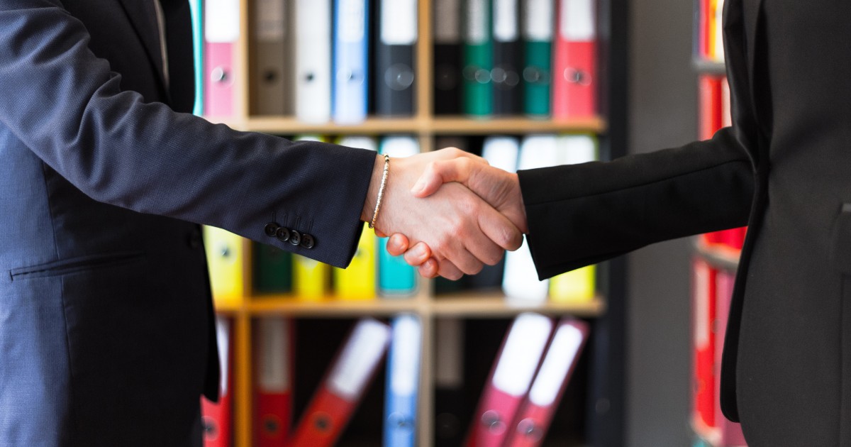 Working Together for Success Shaking hands over a successful relationship